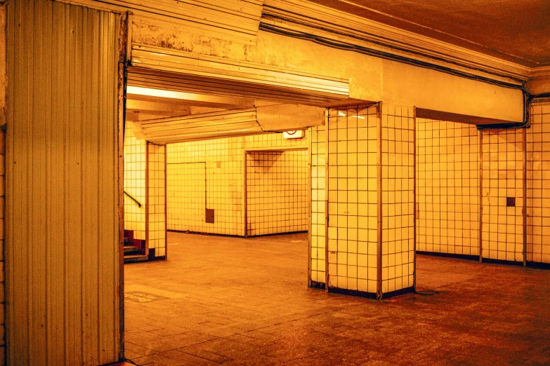 a subway station with many stalls and tiled walls