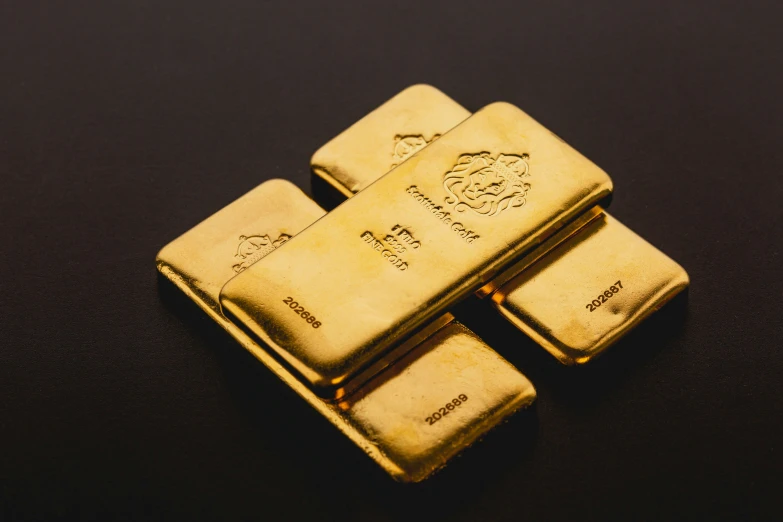 three gold bars sitting on top of each other
