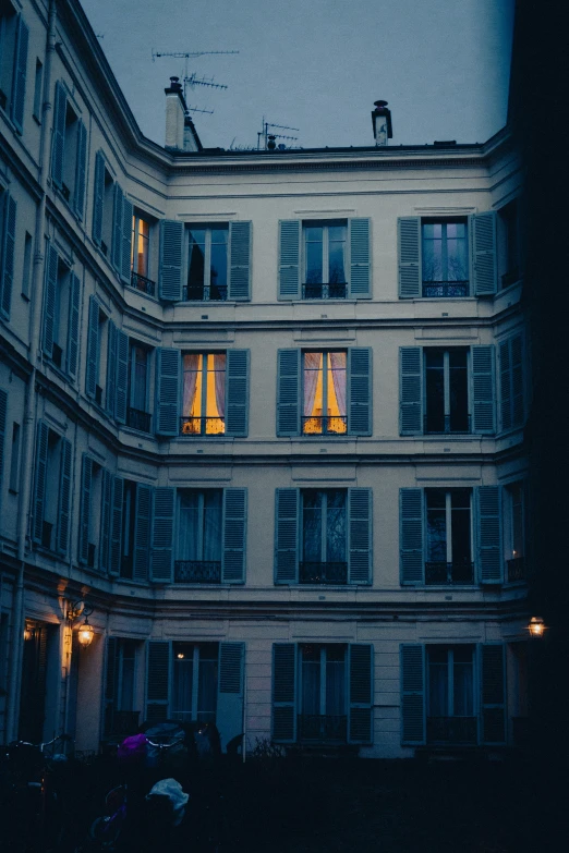 a building with bright yellow windows on it