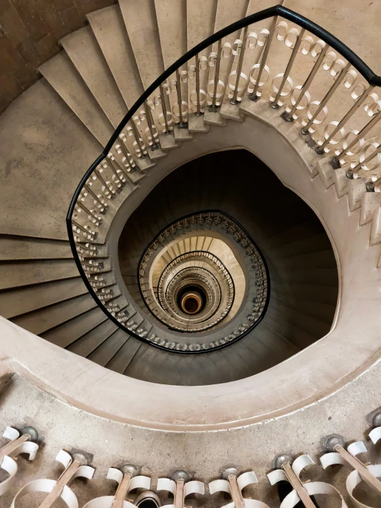 a spiral staircase with a bunch of handrails