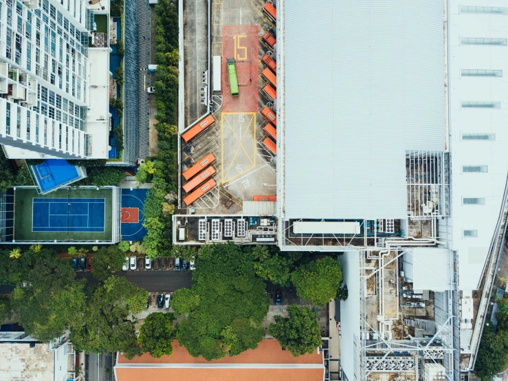 an overhead s of a tennis court and tennis courts in an area of the city