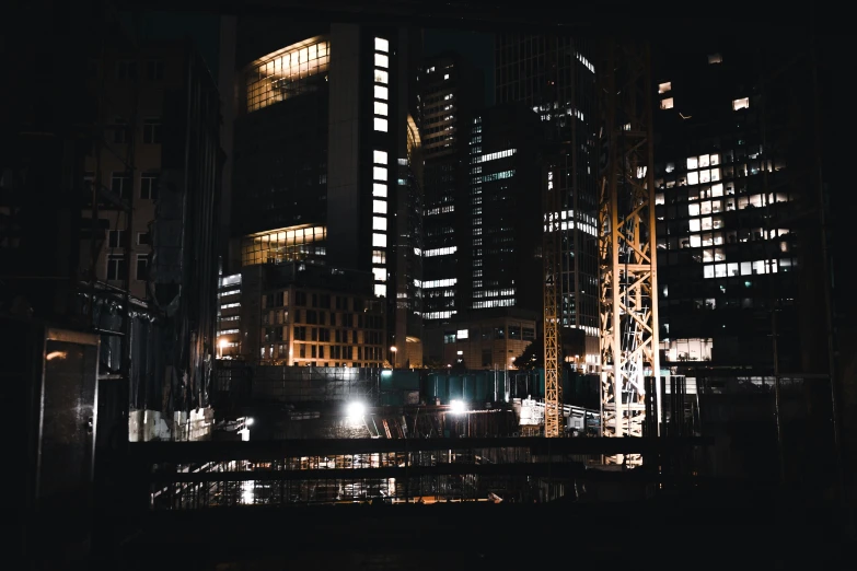 a city skyline at night with buildings and street lights