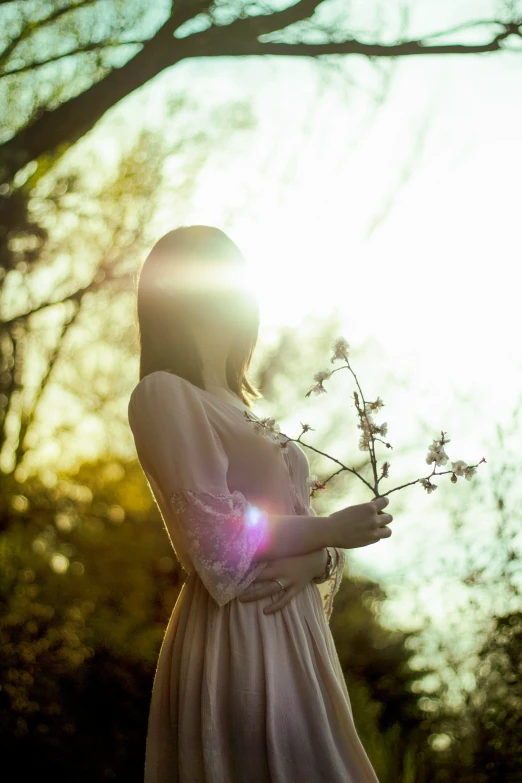 a woman in white dress holding a nch