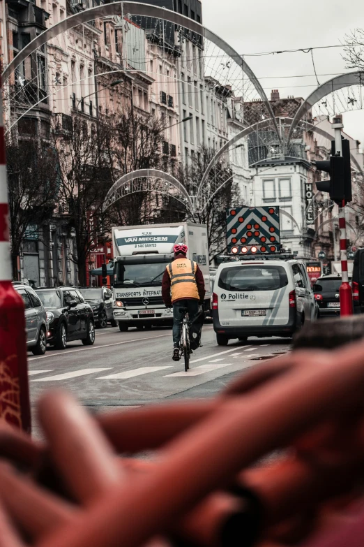 there is a person that is riding a bike in the street