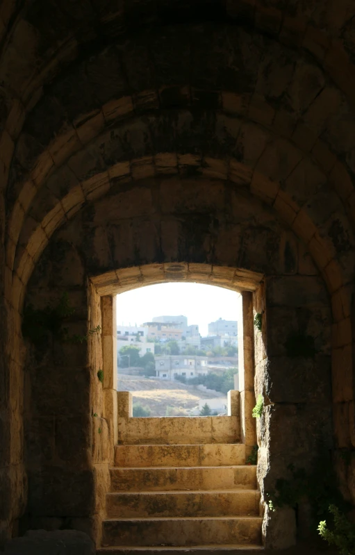 a stone arch with an open window is seen here