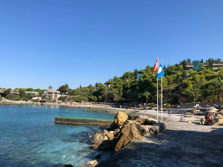 a blue water, rocks, and trees surround the water