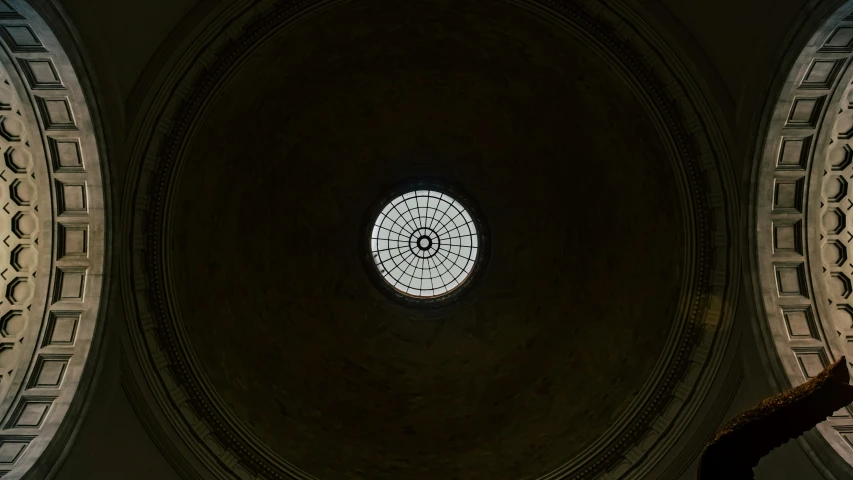 view of a round ceiling with a rose shaped window in it