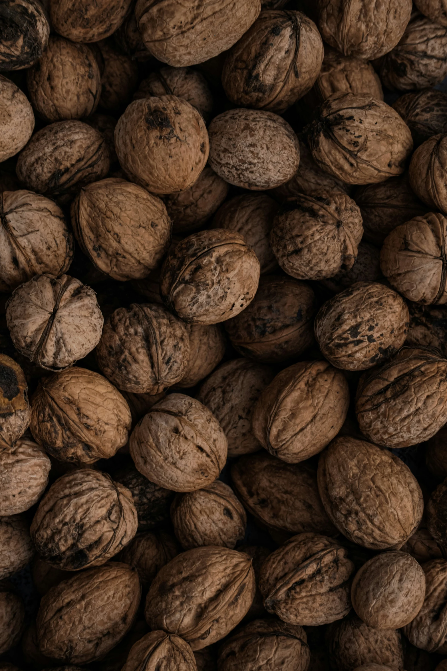 walnuts in a basket is stacked high