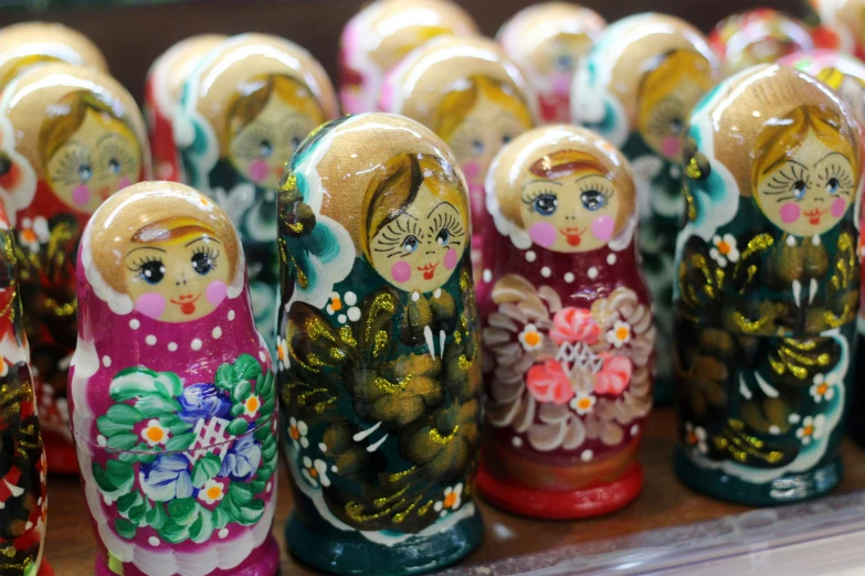 a close up view of many wooden russian nesting dolls