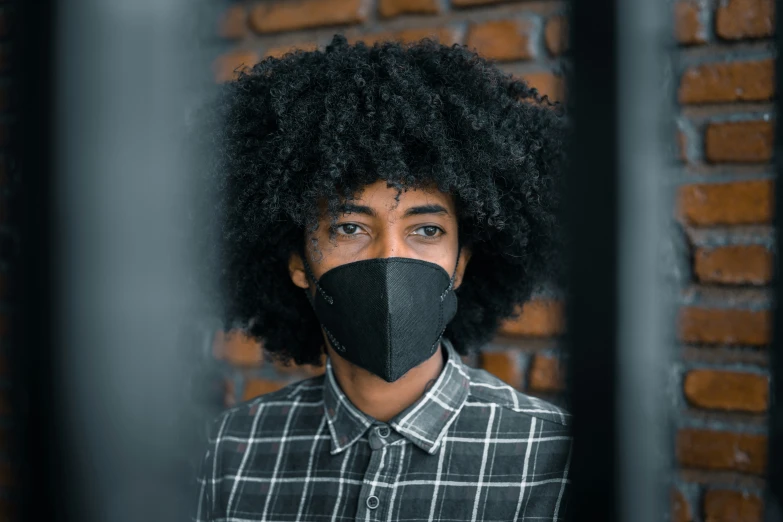 a man with a black mask covering his face