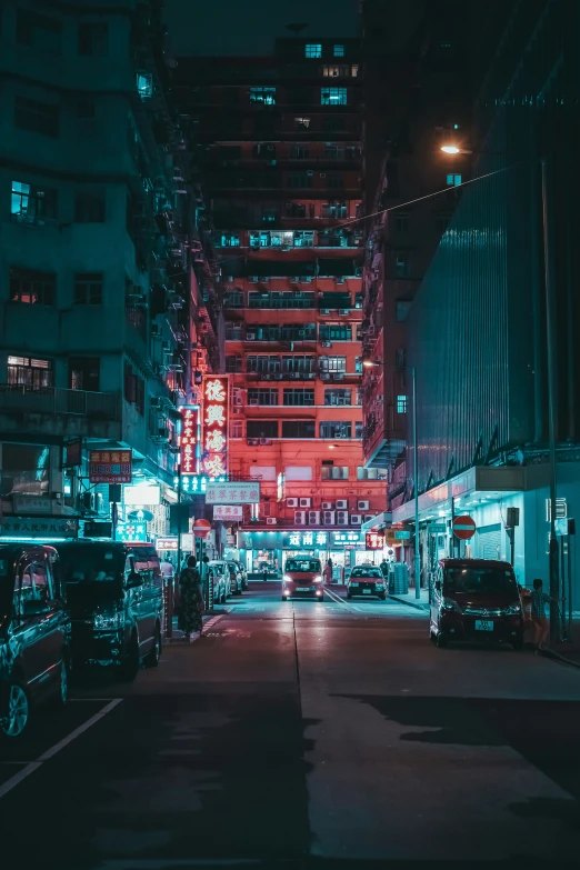 a night time city street filled with vehicles