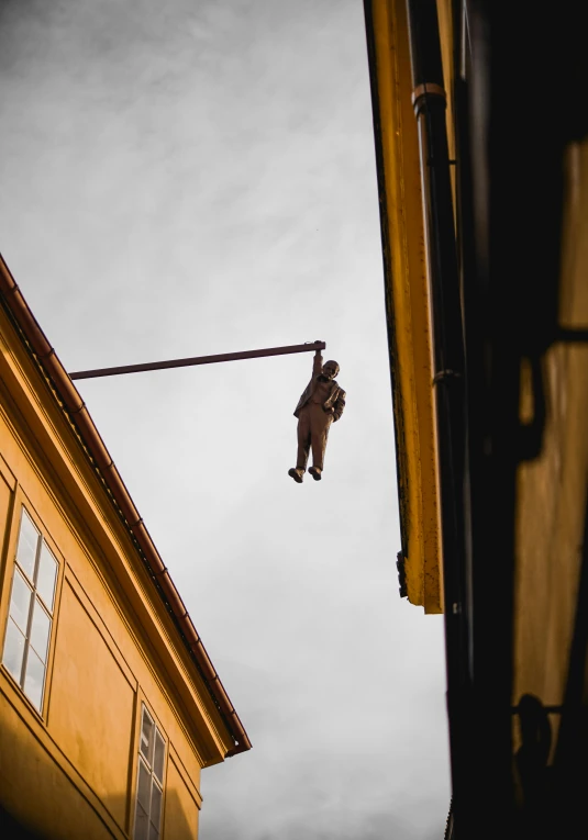 a man on a tight rope between buildings