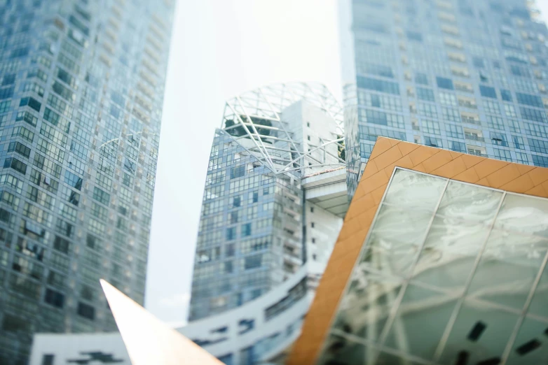 some buildings are next to each other with their reflections