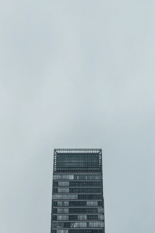 tall office building surrounded by a lot of windows