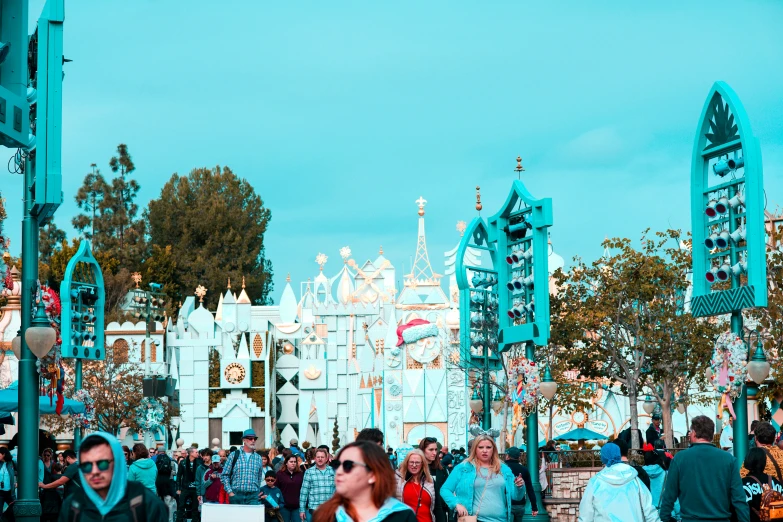 people are walking in a large park during the day