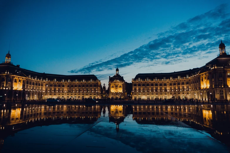 night in a european country with a building reflection in the water