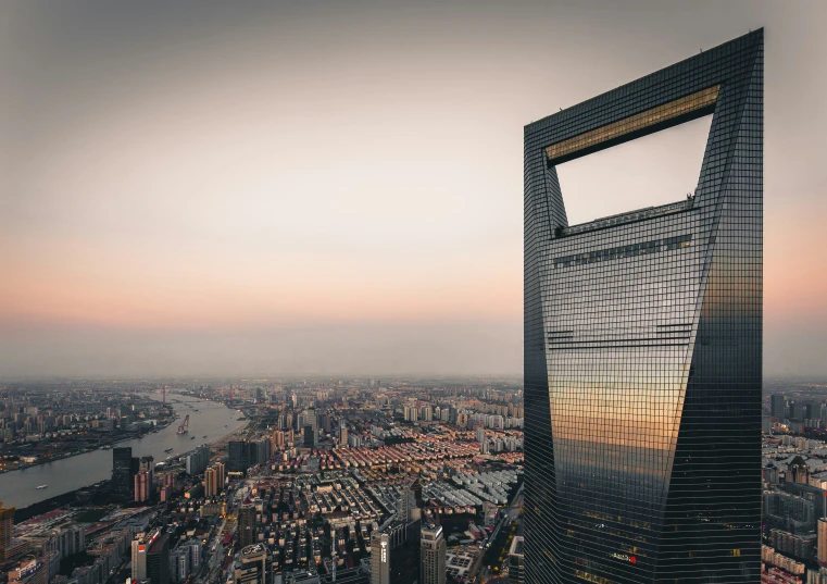 an aerial view of city buildings in the sunset