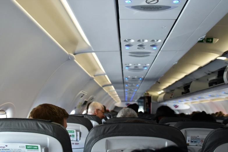 inside of an airplane with the seats facing downward