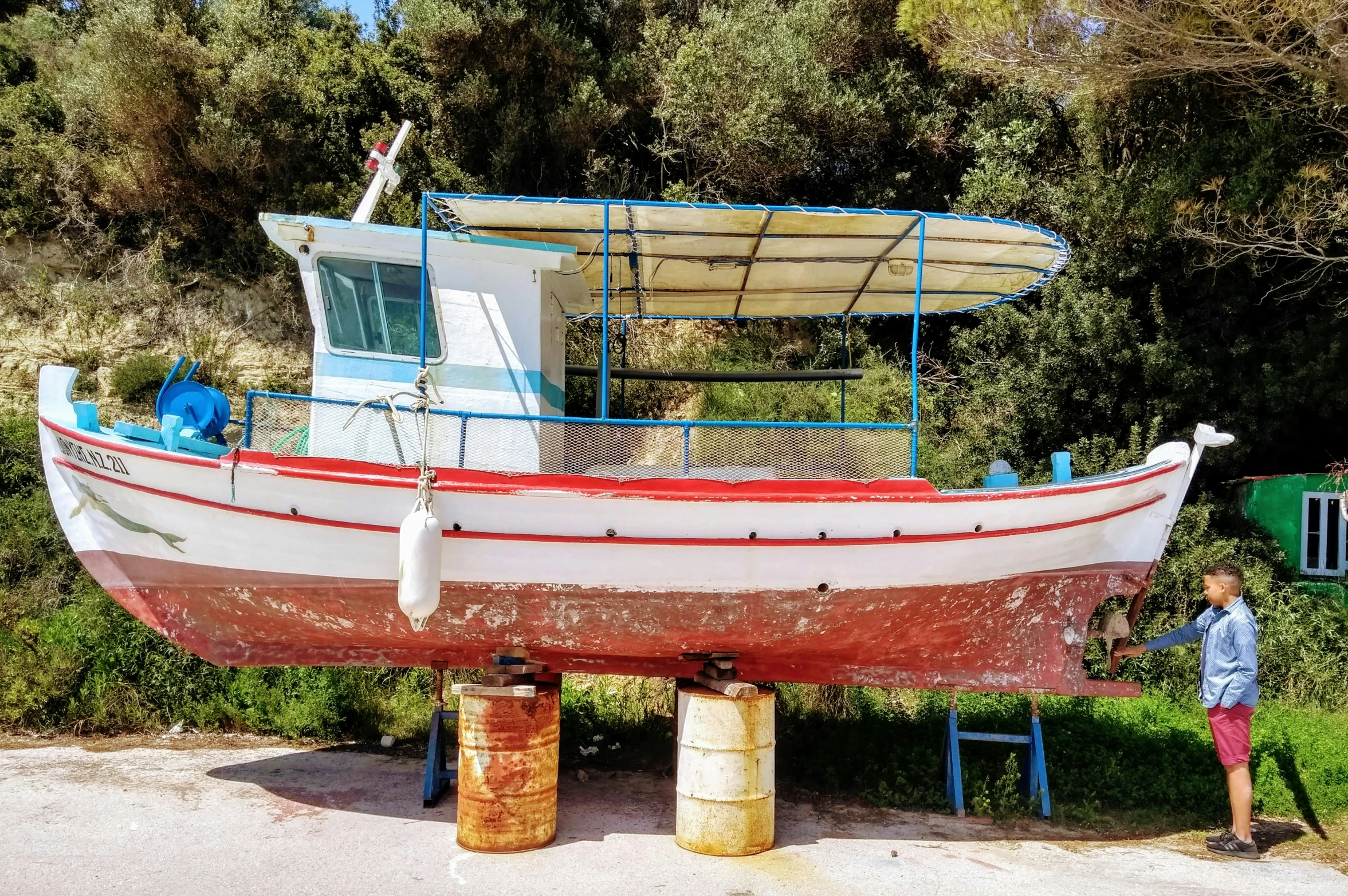 a large boat sitting on top of a sandy beach