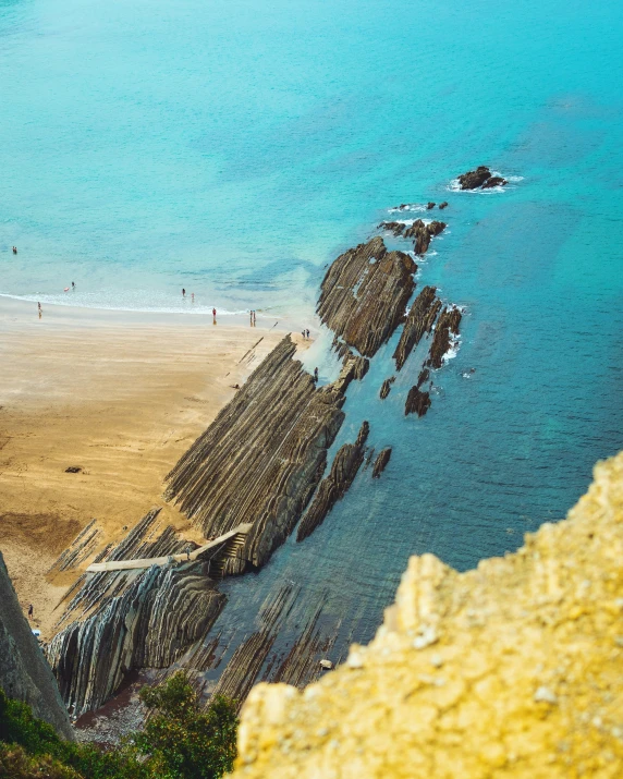 a view of a beach and the ocean from a high angle