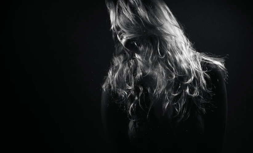 black and white pograph of a woman with long hair