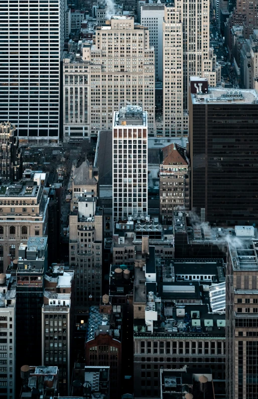 the sky is blue and cloudy above large city buildings