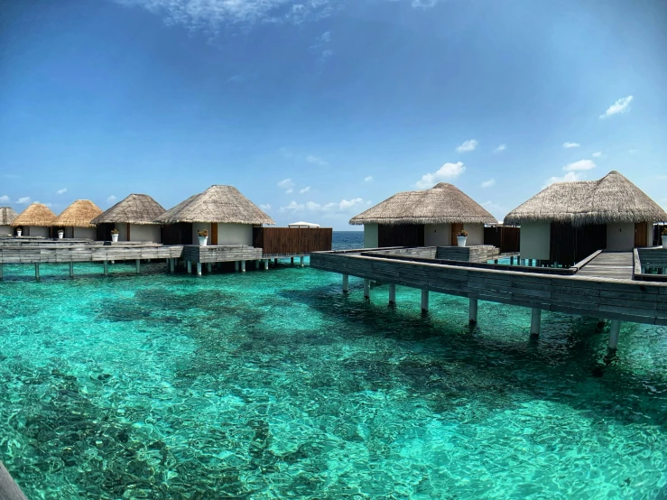 the waters in front of huts are very clear