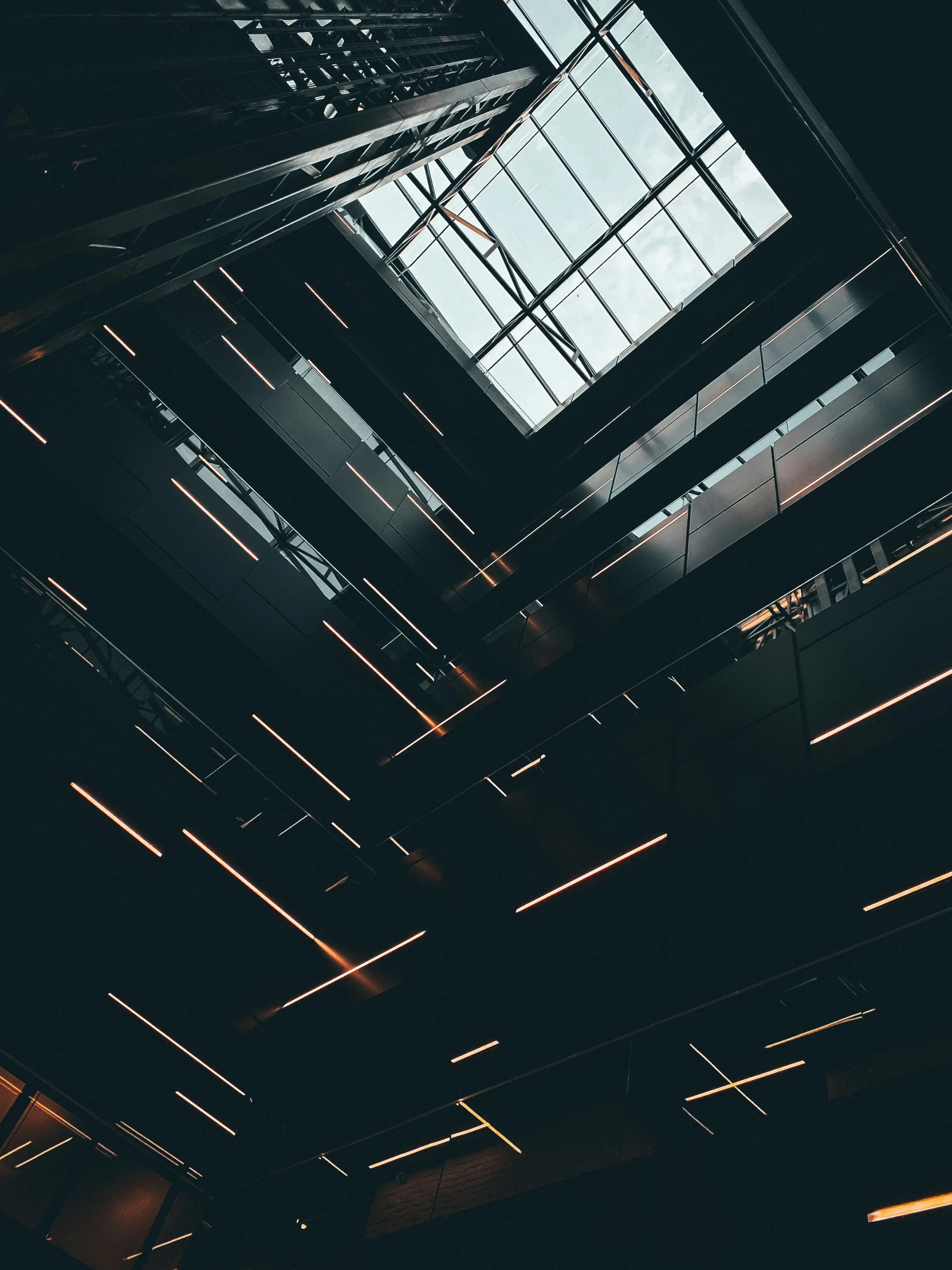 sunlight through the open roof of a building