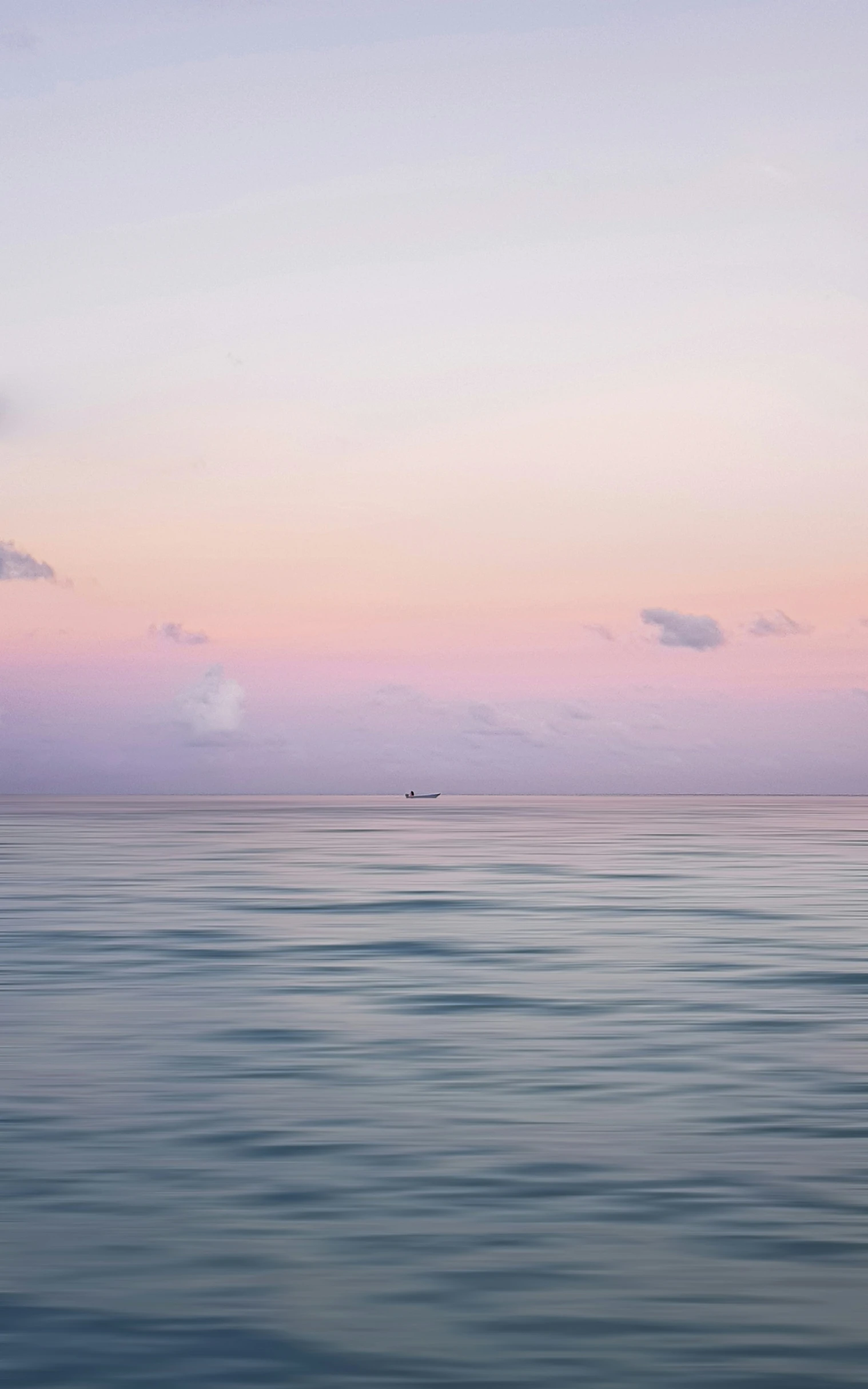 two boats out in the water on a cloudy day