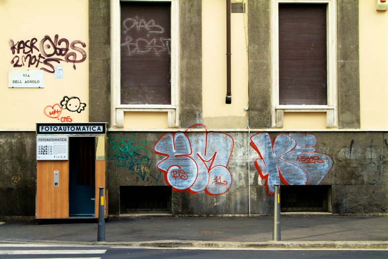 a street corner with graffiti on the wall