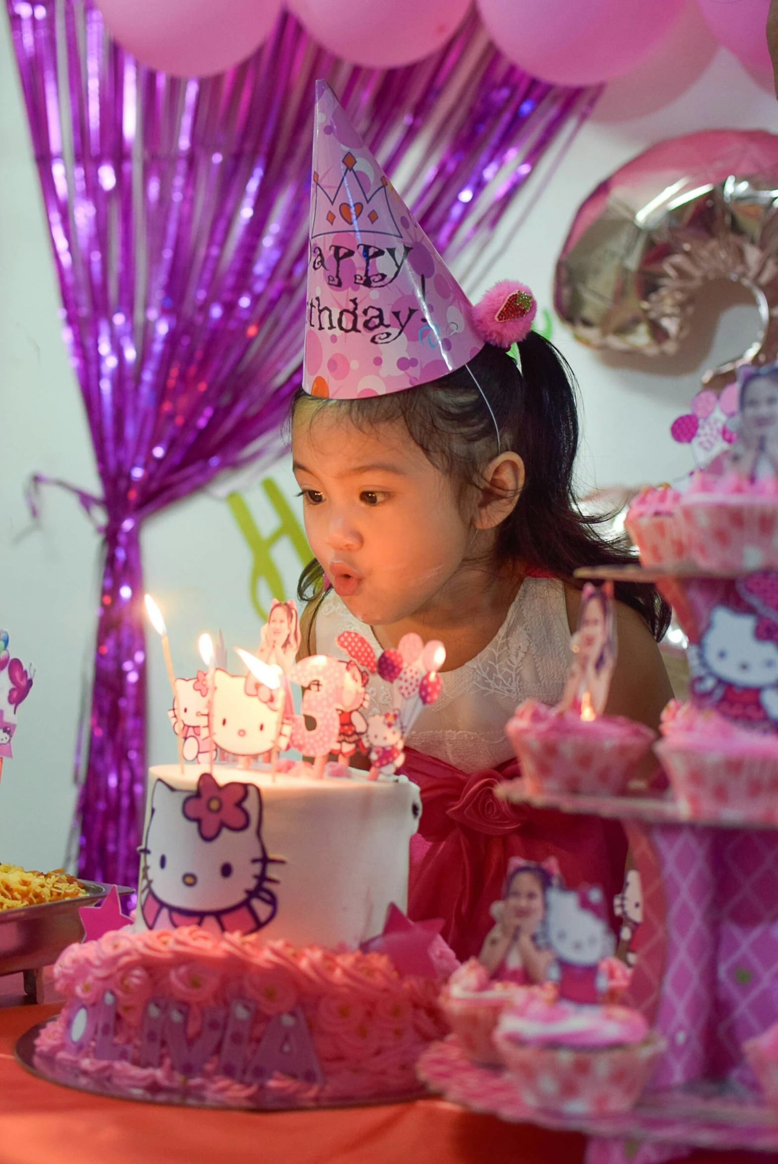 a  with a birthday cake in her hand