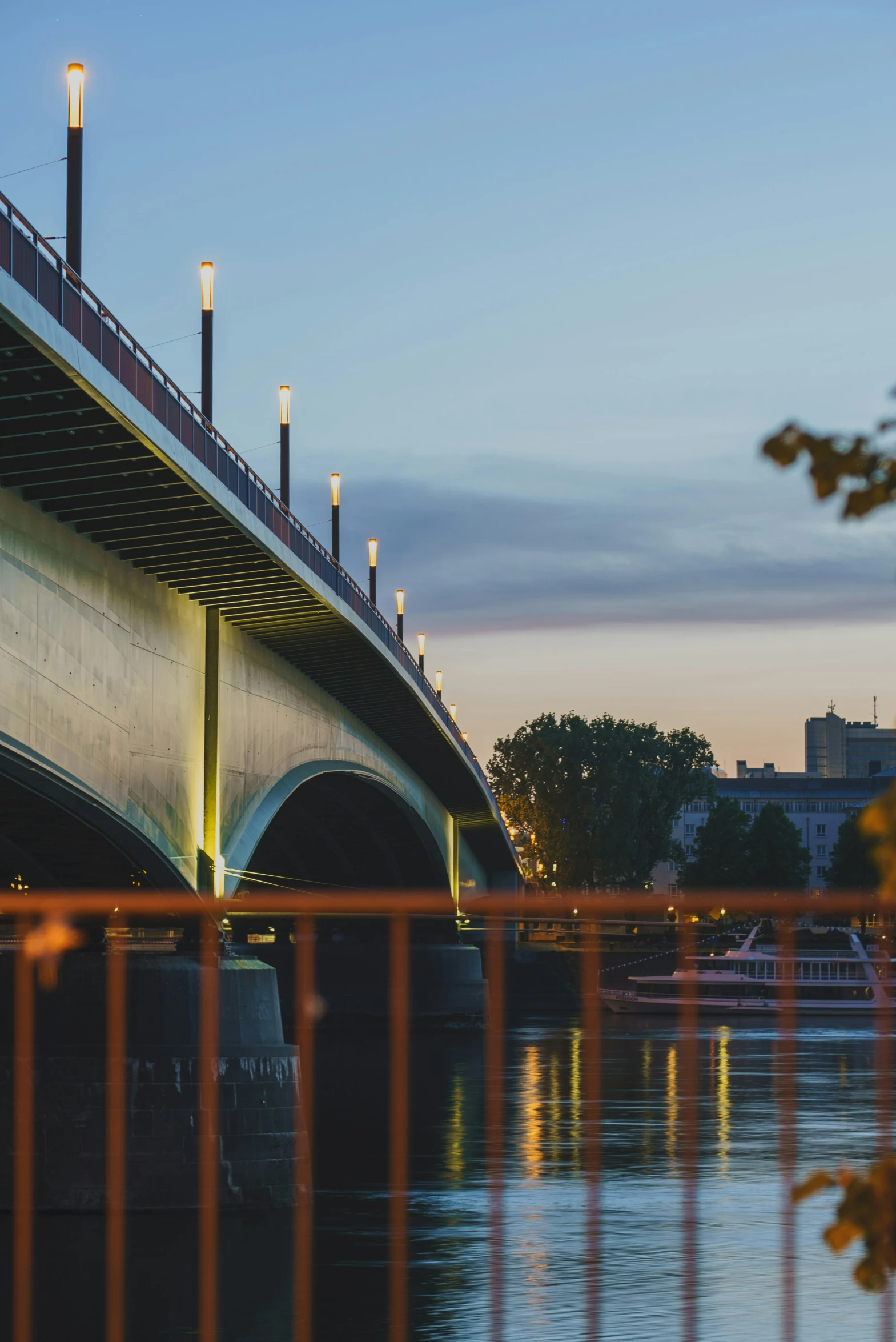 the bridge on the water is lit up with lightening