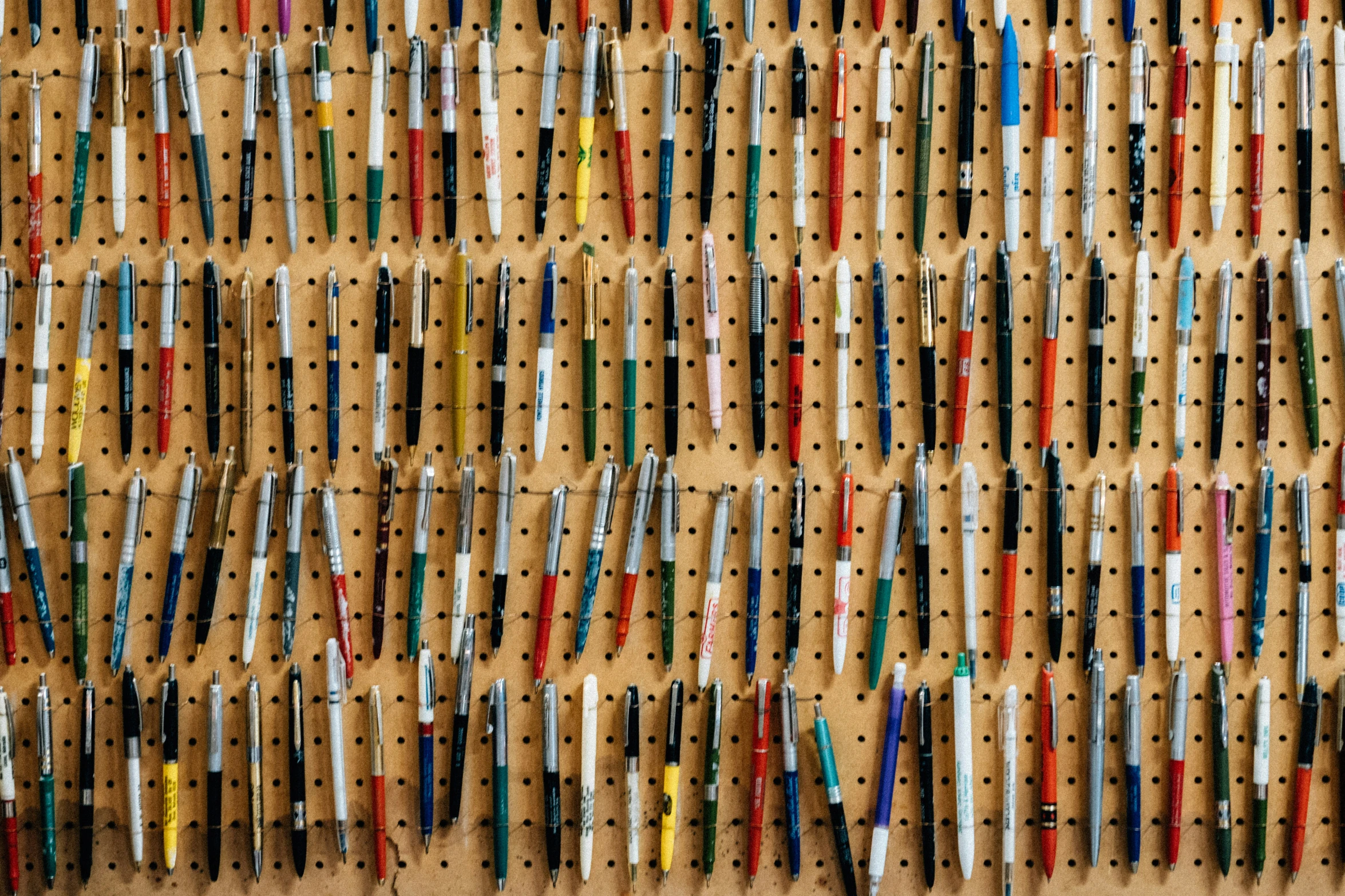 a bulletin board displaying some very large and tiny objects