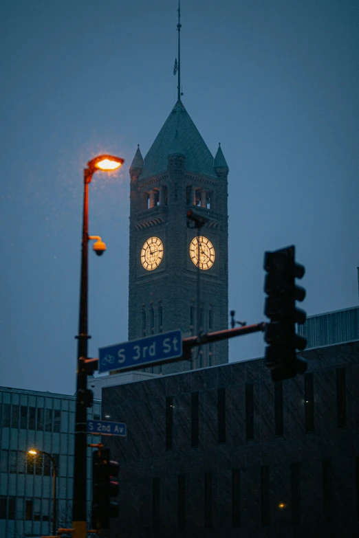 large building with two lights on in the middle of night