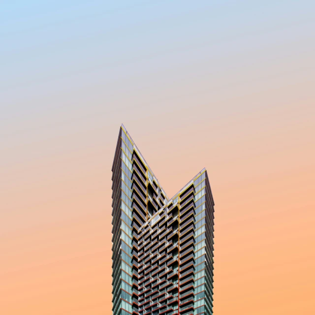 an apartment building is seen in front of the sunset sky