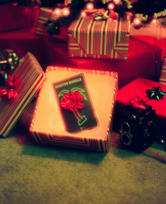 presents on a table with the christmas tree in the background