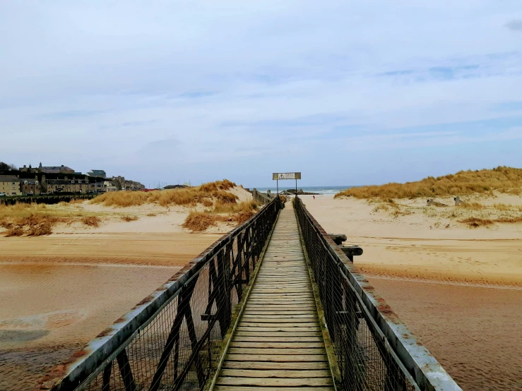 a pier sits out to the side of the ocean