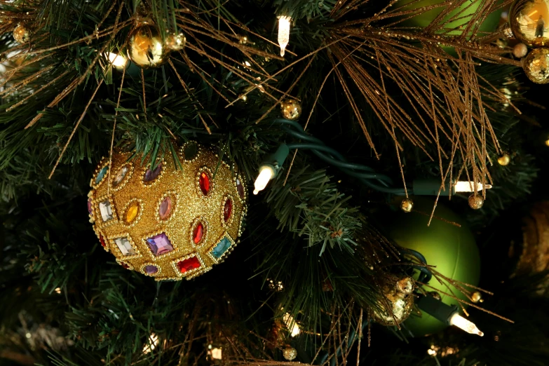 christmas ornaments in the shape of balls on a tree