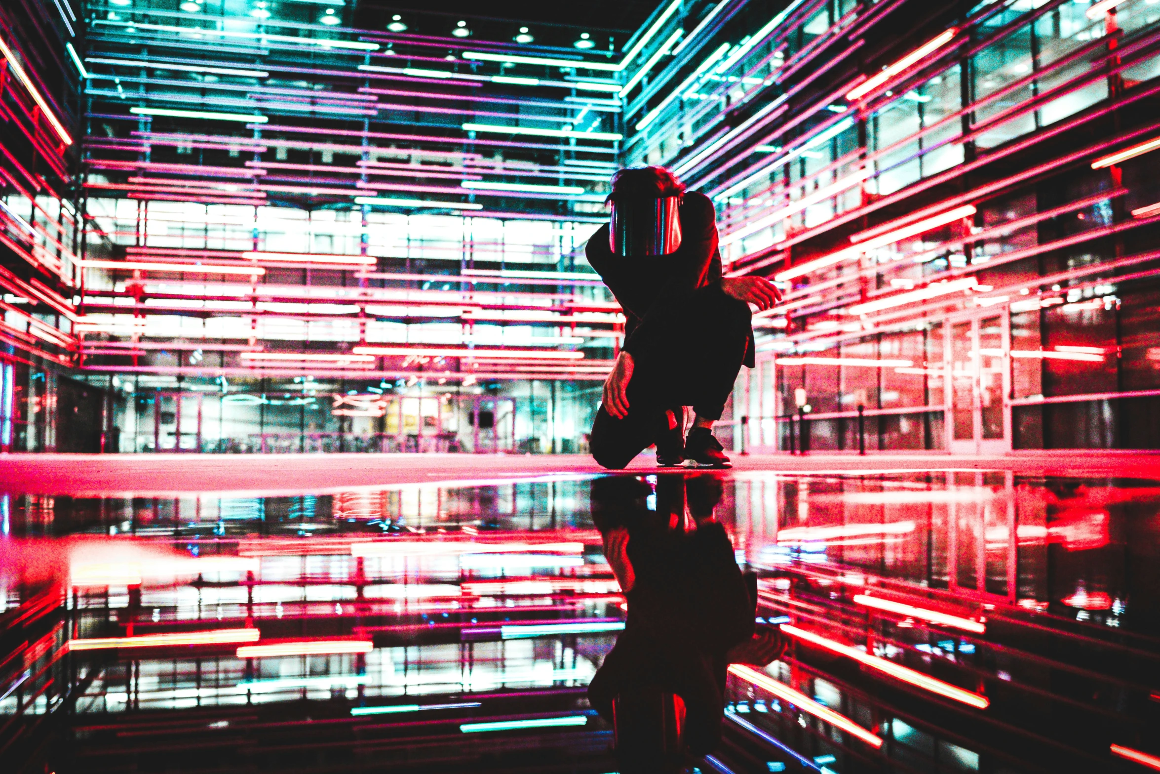 a person standing inside a bright and futuristic building