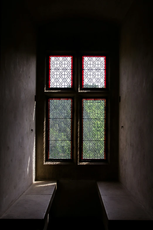 window with decorative design in dimly lit area