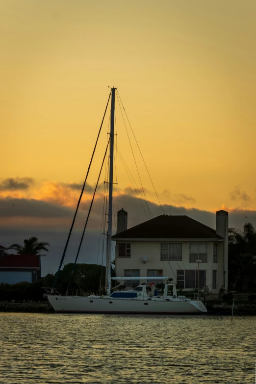 a house on the water near some boats