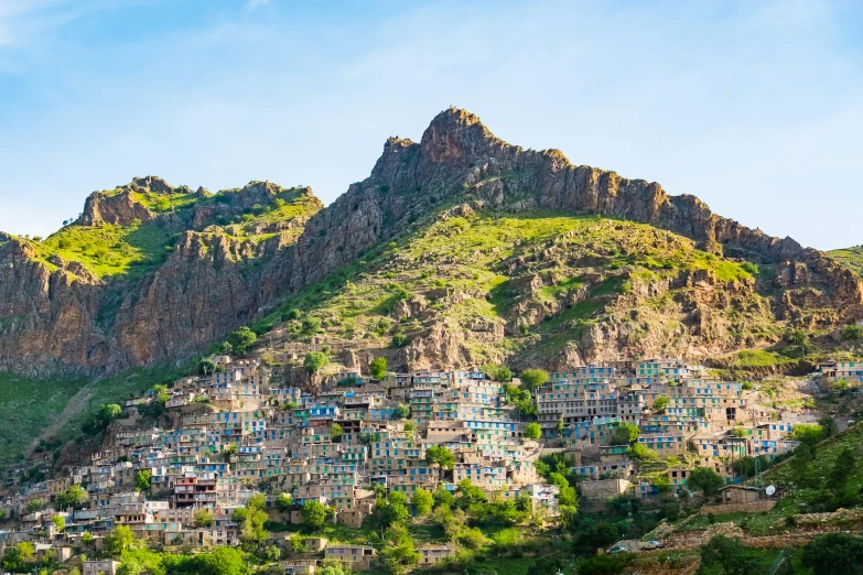 a small mountain village perched on a cliff overlooking the surrounding hill