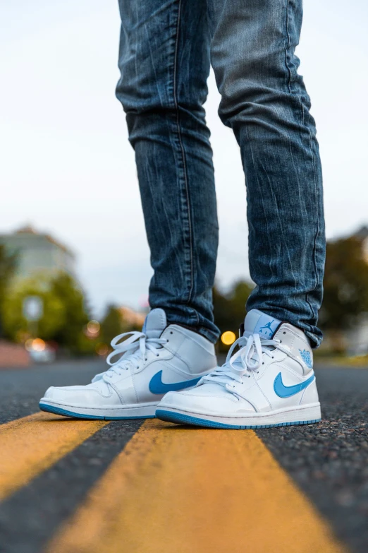 a man with his feet on top of a skateboard