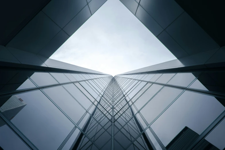 upward view into the glass skyscrs in a city