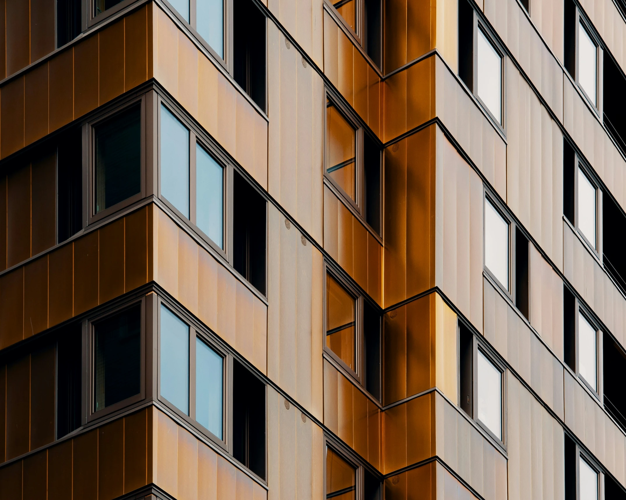 a tall building with windows and bars and window frames