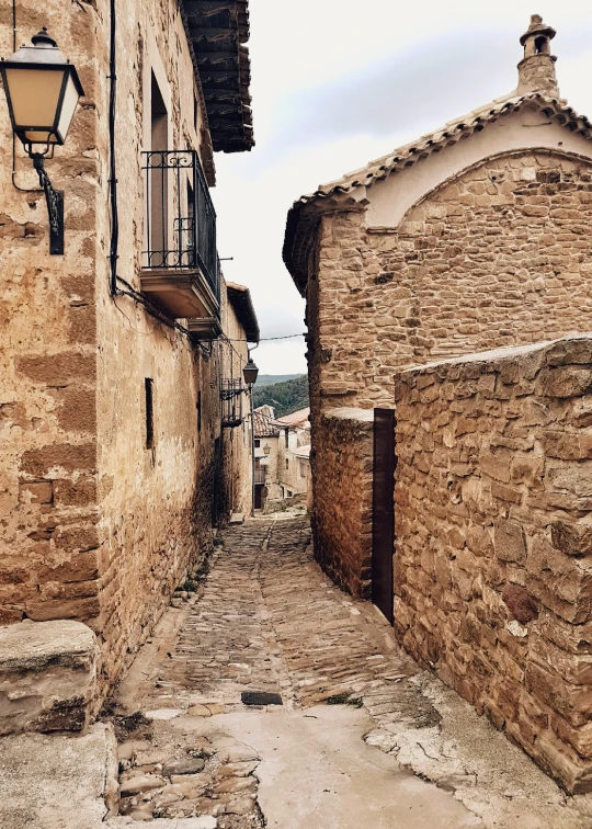 an old street with cobblestone brick buildings