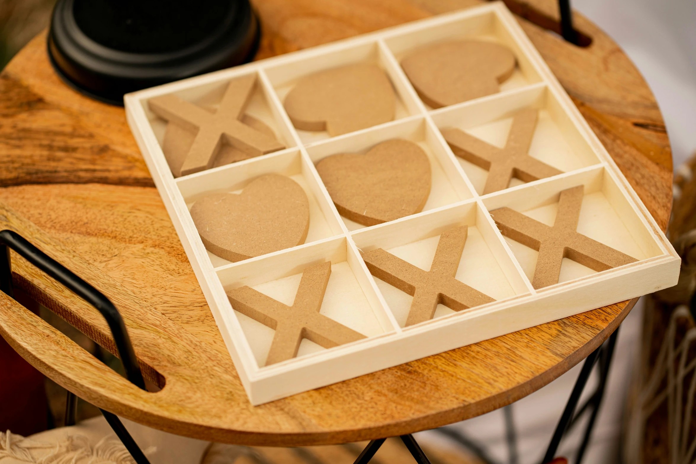 wooden shapes and cut out shapes on top of a table