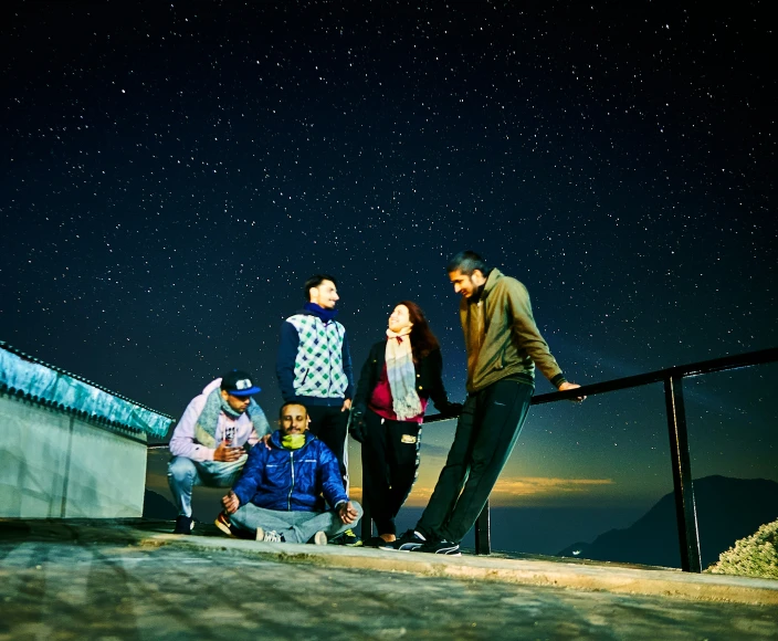 five people are standing together on the steps