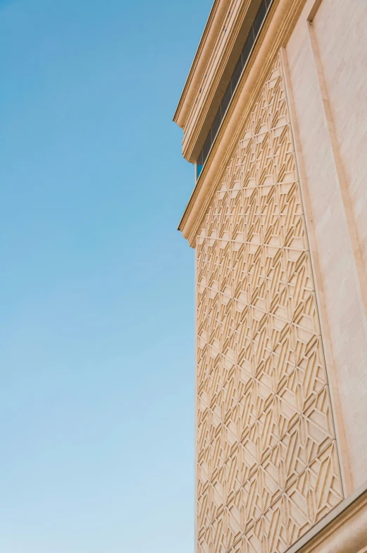 a building with carvings and a bird sitting on top