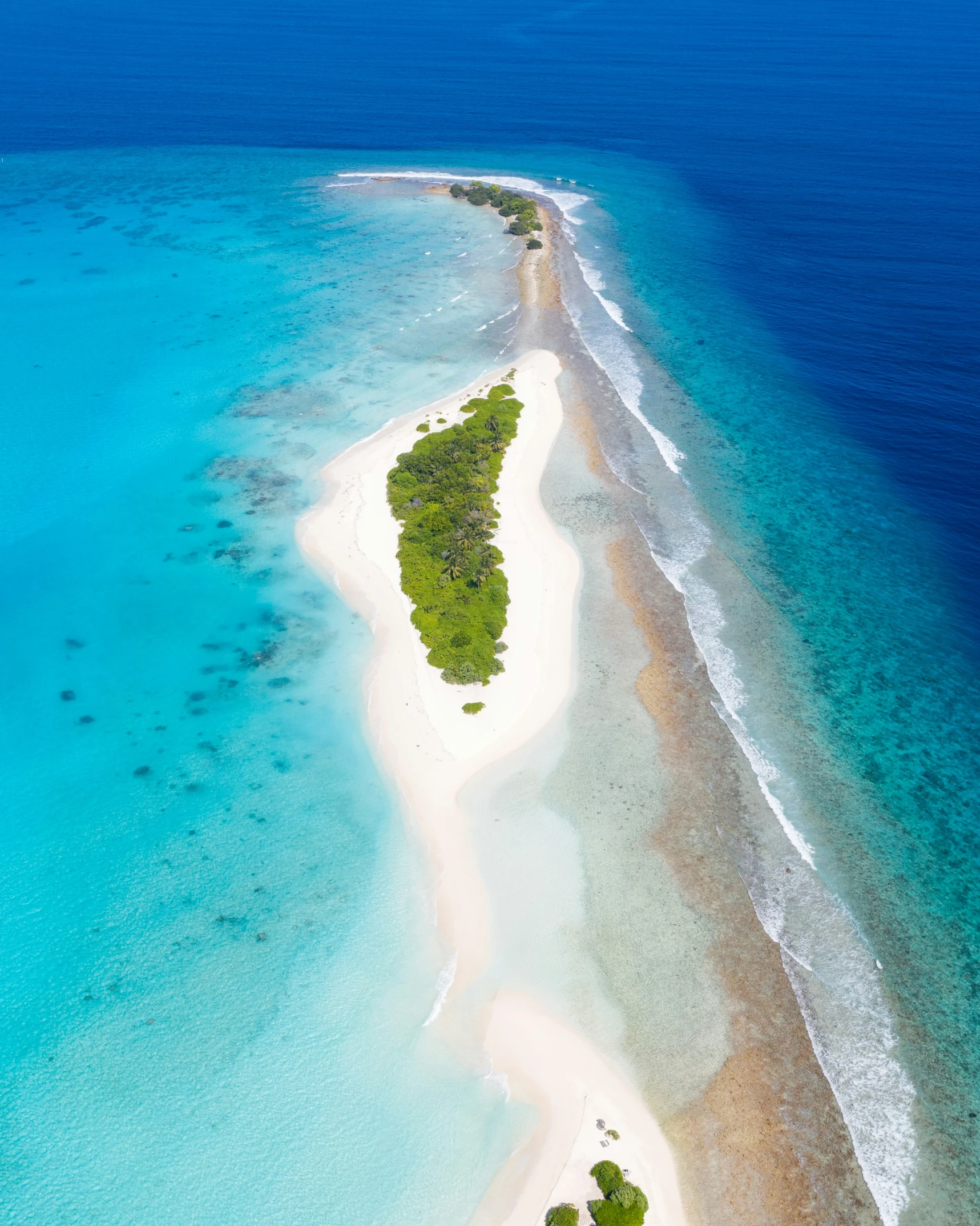 an aerial view of a sandy tropical island